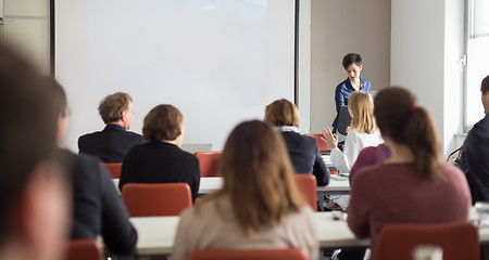 Image showing Woman giving presentation in lecture hall at university.