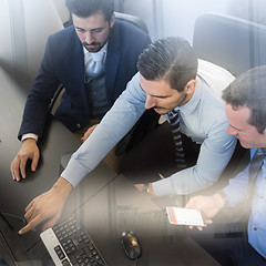 Image showing Business team analyzing data on computer.