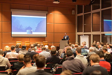 Image showing Business speaker giving a talk in conference hall.