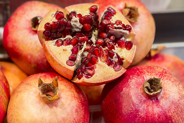 Image showing Ripe Juicy pomegranates on market close up