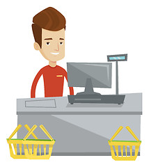 Image showing Cashier standing at the checkout in supermarket.