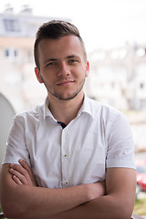 Image showing man standing at balcony