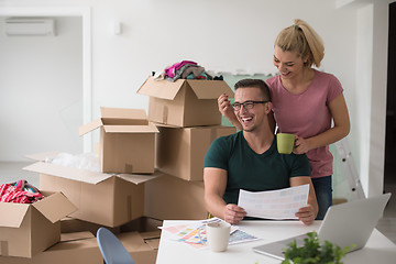 Image showing Young couple moving in a new home