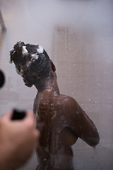 Image showing African American woman in the shower