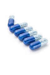 Image showing Blue capsules and pills background