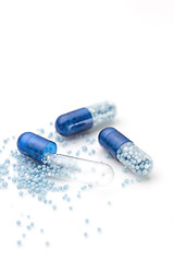 Image showing Blue capsules and pills background