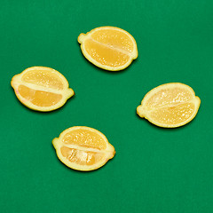 Image showing Lemons on green background