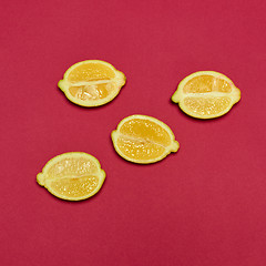 Image showing Lemons on red background