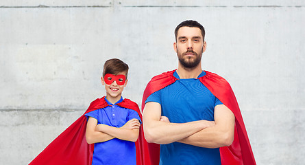 Image showing man and boy wearing mask and red superhero cape