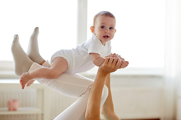 Image showing mother playing with baby at home