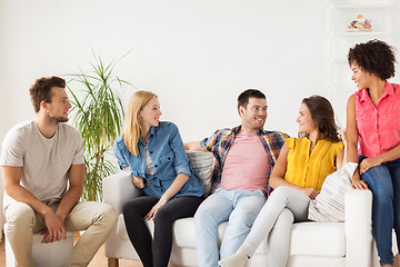 Image showing group of happy friends talking at home