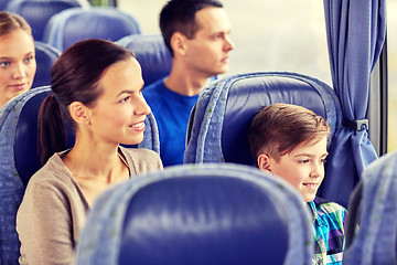 Image showing happy family riding in travel bus