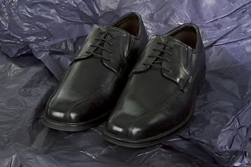 Image showing Black Mens shoes on black Paper