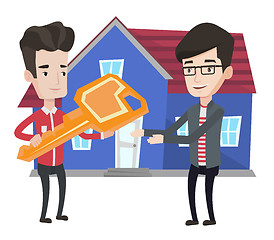 Image showing Real estate agent giving key to new house owner.