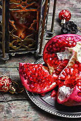 Image showing Arabic candle holder and pomegranate