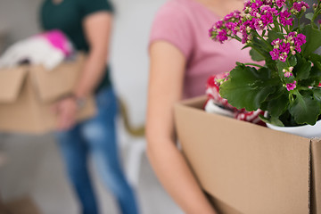 Image showing young couple moving into a new home