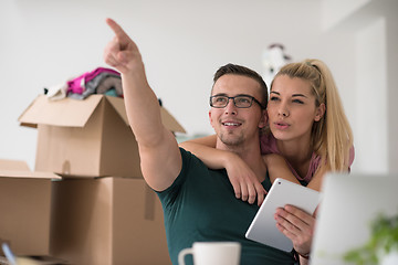 Image showing Young couple moving in a new home