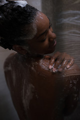 Image showing African American woman in the shower