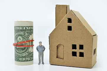 Image showing Man with money and home