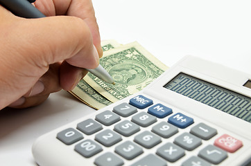 Image showing Calculator, money and pen isolated on white