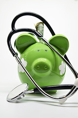 Image showing Piggy bank and stethoscope