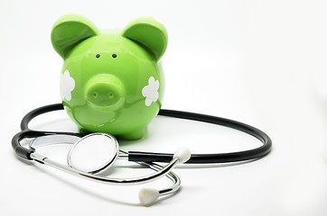 Image showing Piggy bank and stethoscope