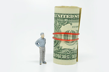 Image showing Figure of businessman and one dollar bill