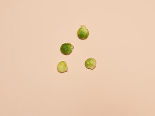 Image showing The piles of Brussels sprouts on a pink background