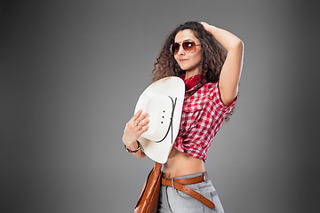 Image showing The cowgirl fashion woman over a gray background