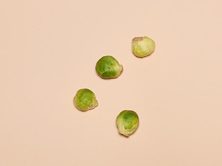 Image showing The piles of Brussels sprouts on a pink background