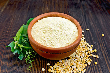 Image showing Flour pea in bowl on dark board