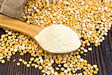 Image showing Flour pea in wooden spoon on board