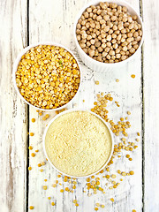 Image showing Flour pea and split pease in three bowls on board top