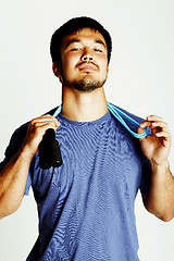 Image showing young asian guy with skipping rope on white background ready to 