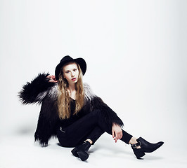 Image showing young blonde teenage girl in hat and fur coat, fashion dressed m