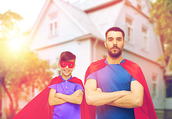 Image showing man and boy wearing mask and red superhero cape