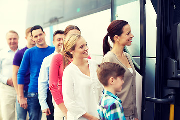 Image showing group of happy passengers boarding travel bus