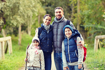 Image showing happy family with backpacks hiking