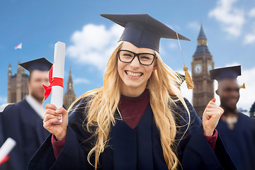 Image showing happy student with diploma celebrating graduation