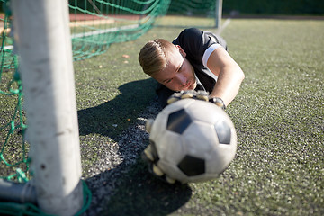 Image showing goalkeeper with ball at football goal on field