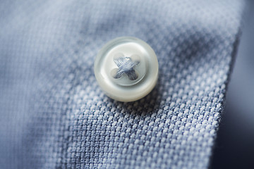 Image showing close up of blue shirt button