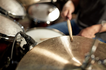 Image showing male musician playing drums and cymbals at concert