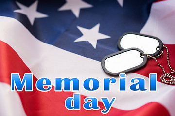 Image showing memorial day words over american flag and dog tags