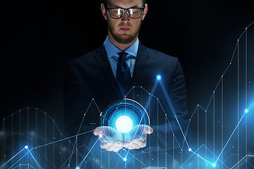 Image showing businessman with virtual diagram chart projection
