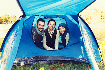 Image showing happy family with tent at camp site