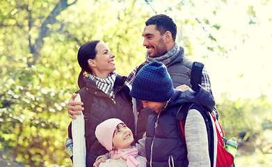 Image showing happy family with backpacks hiking