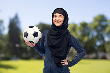 Image showing happy muslim woman in hijab with football