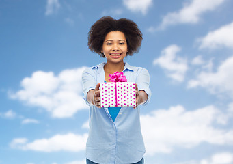 Image showing happy african woman with birthday gift box