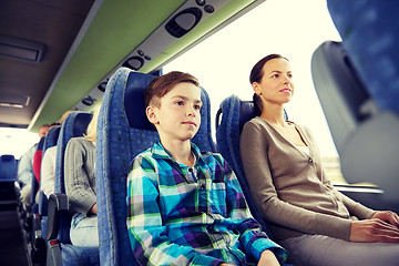 Image showing happy family riding in travel bus