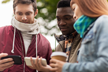 Image showing happy friends with smartphone and coffee outdoors